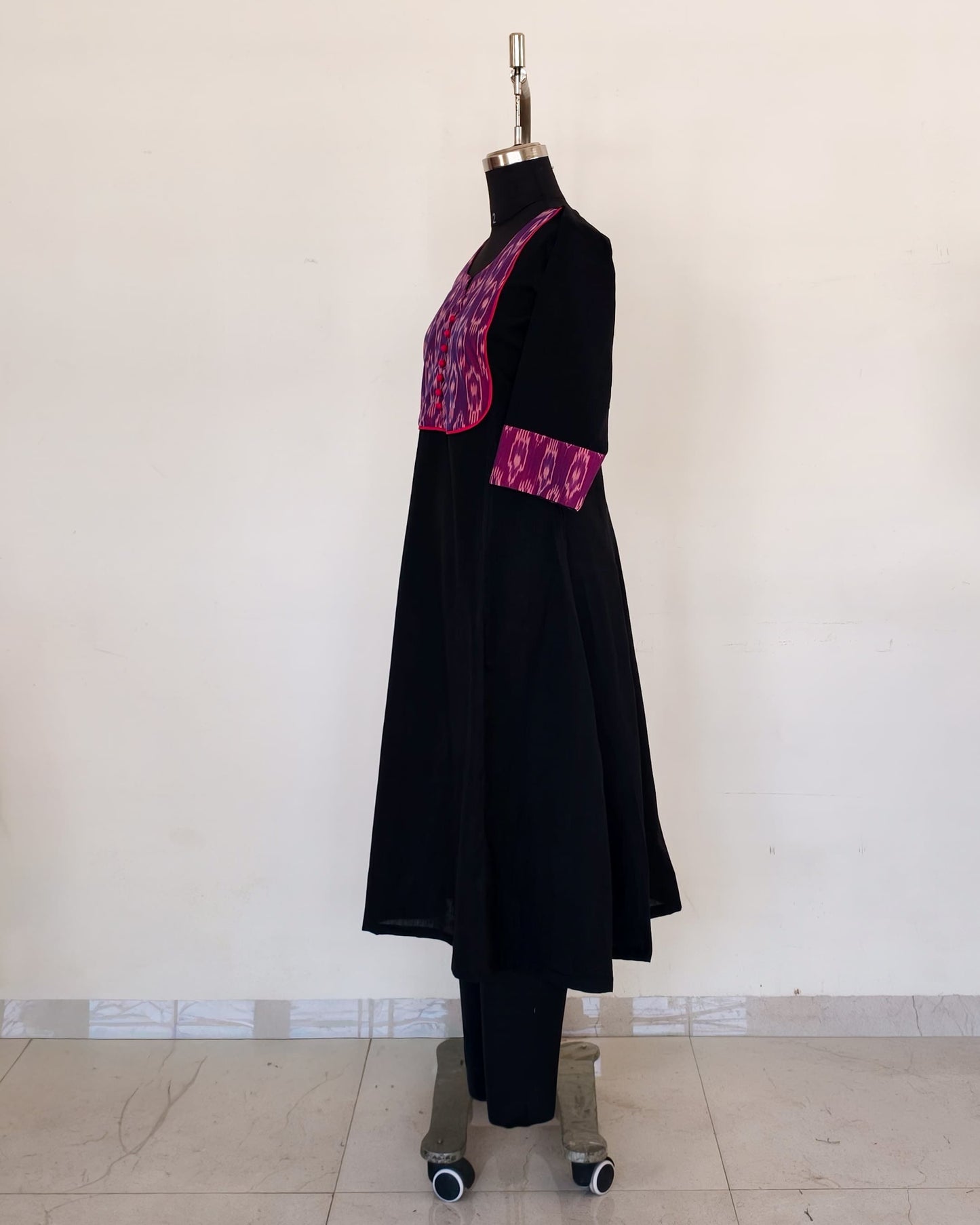 278 Black flare kurta with purple patch and pink potlis