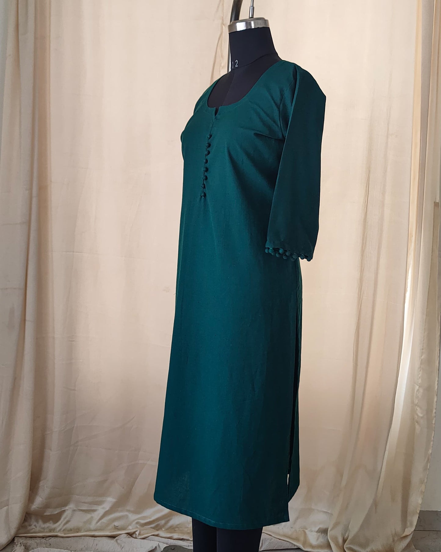 139 Plain Bottle green kurta with potlis