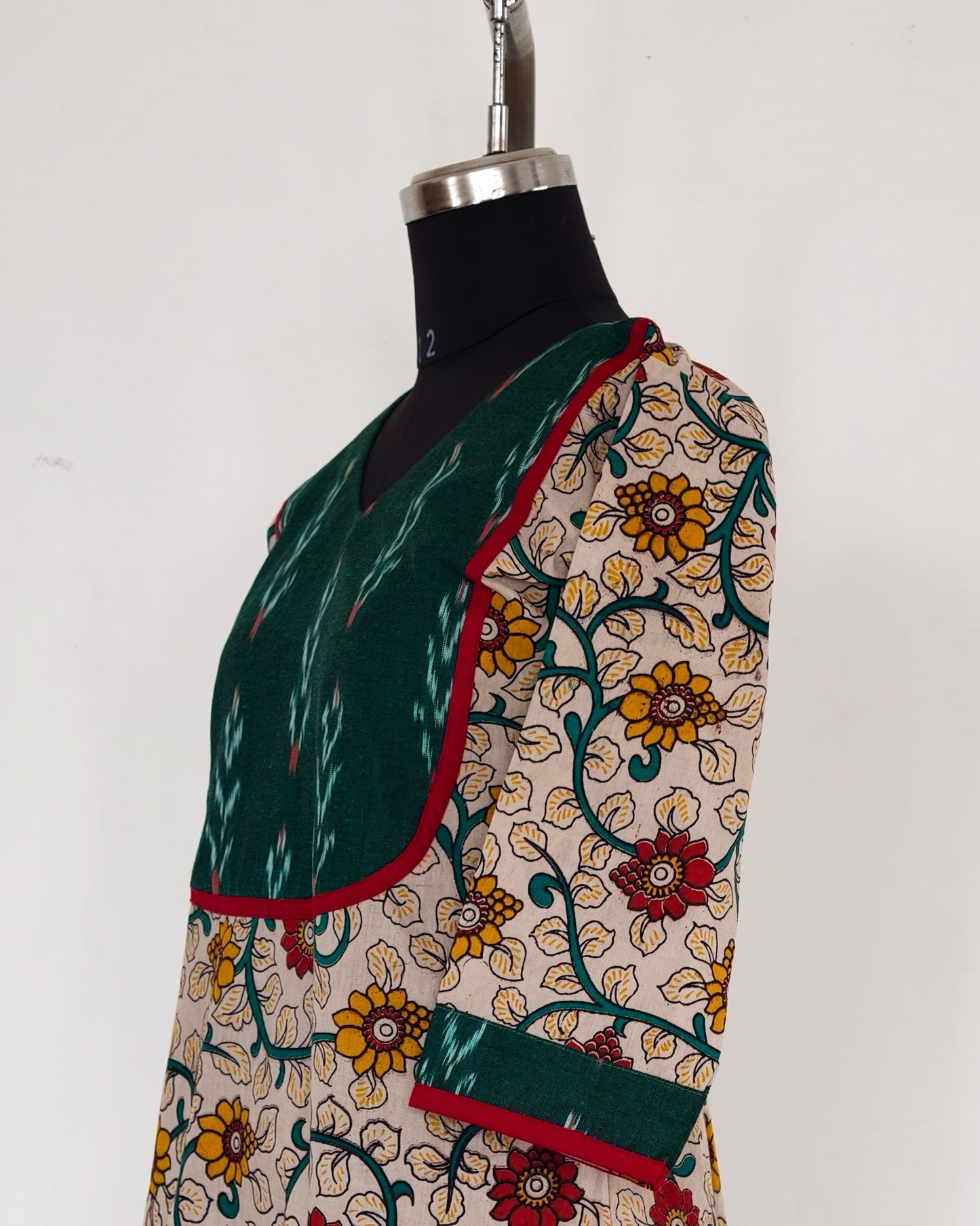 235 Cream floral kalamkari kurta with green ikkat yoke patch