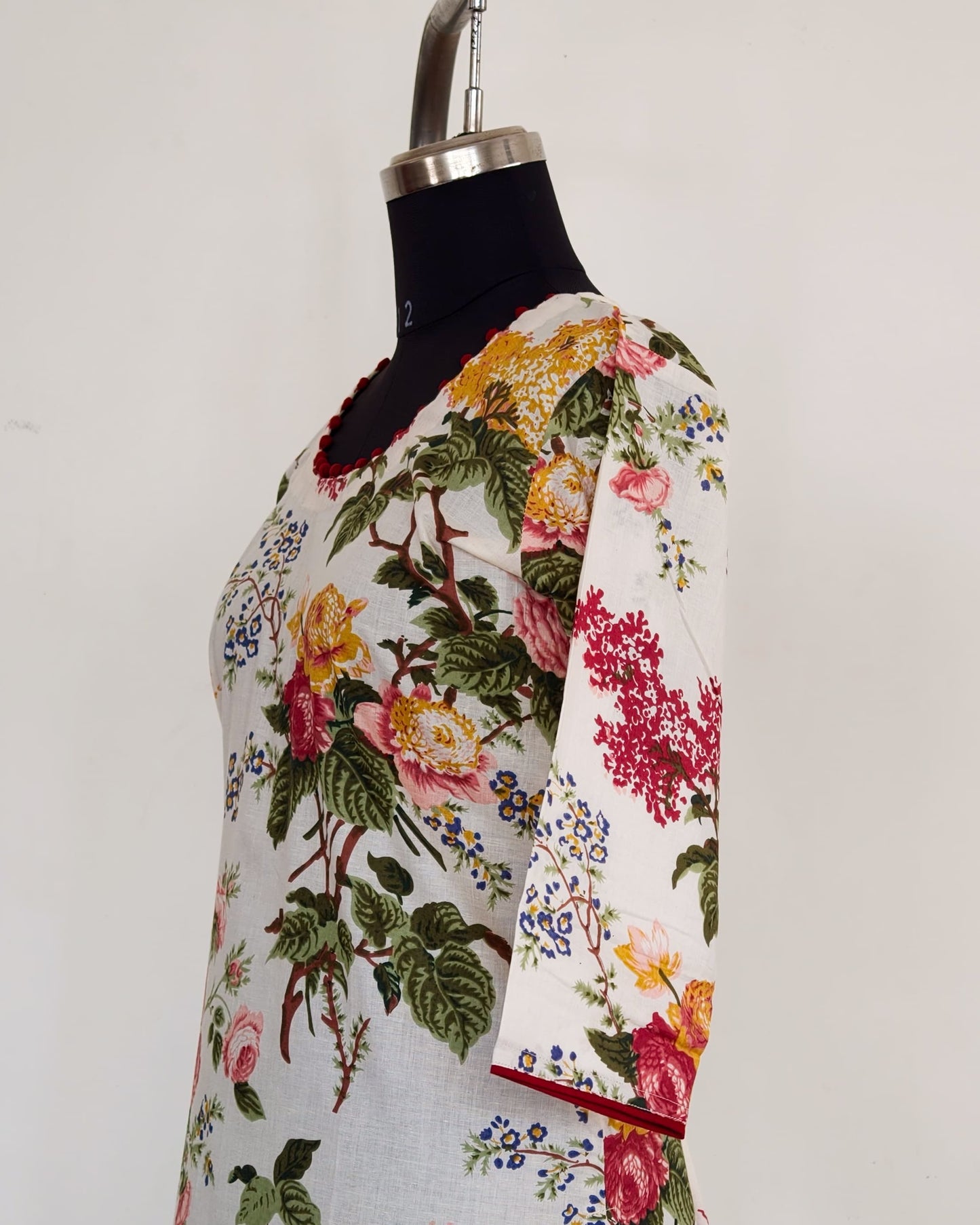 268 White floral kurta with potlis