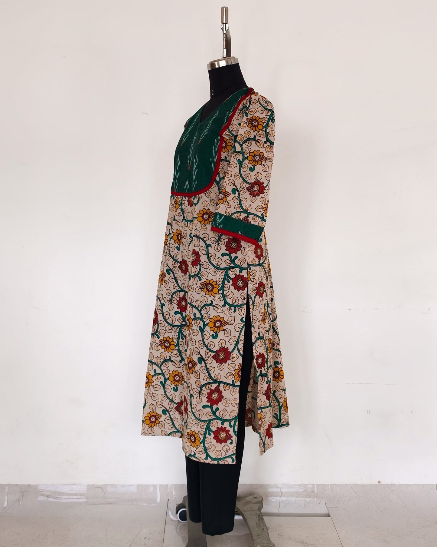 235 Cream floral kalamkari kurta with green ikkat yoke patch