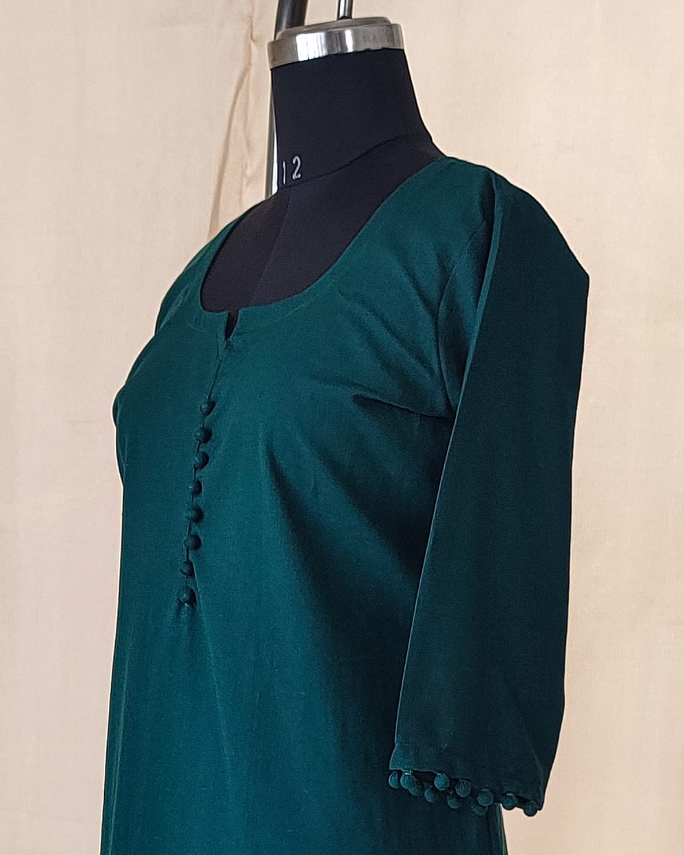 139 Plain Bottle green kurta with potlis