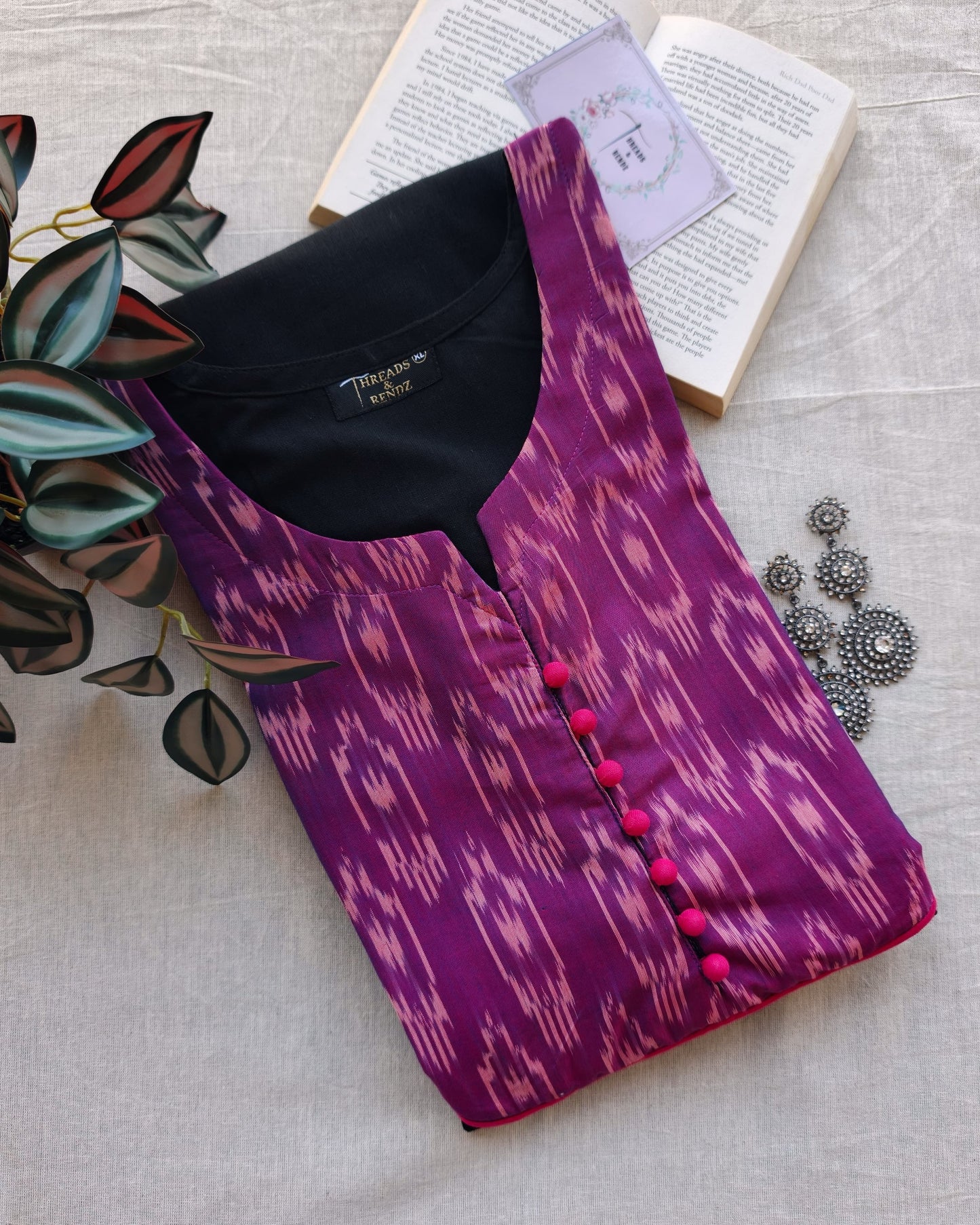278 Black flare kurta with purple patch and pink potlis