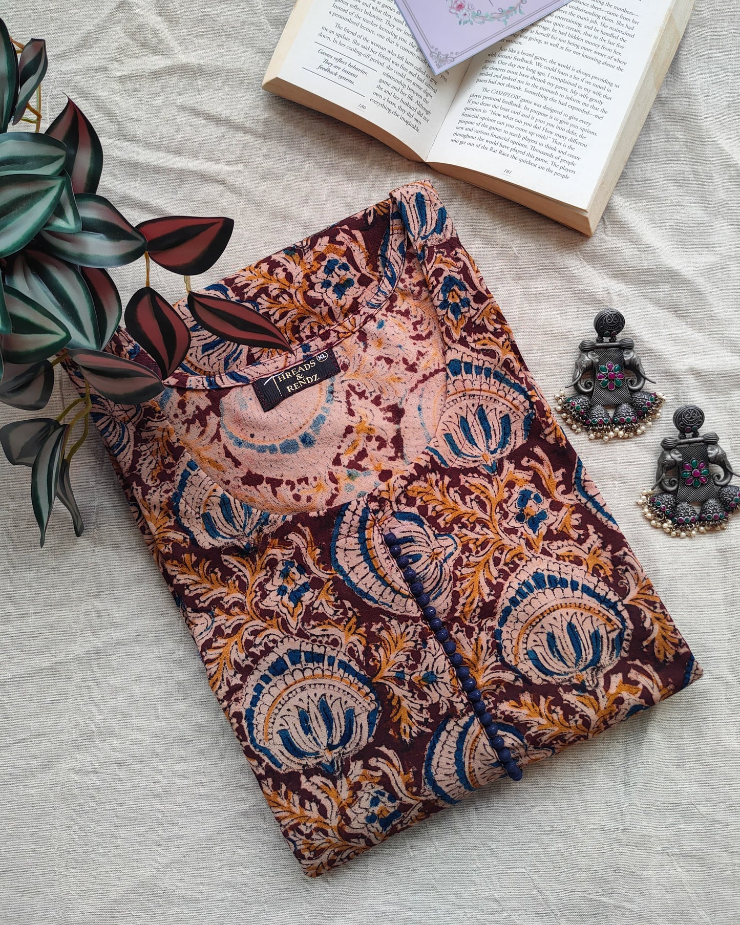 196	Maroon kalamkari A-line kurta with blue potlis