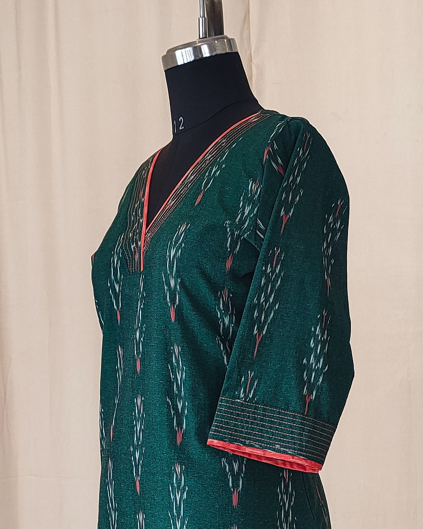 154 Bottle green ikkat kurta with orange detailing
