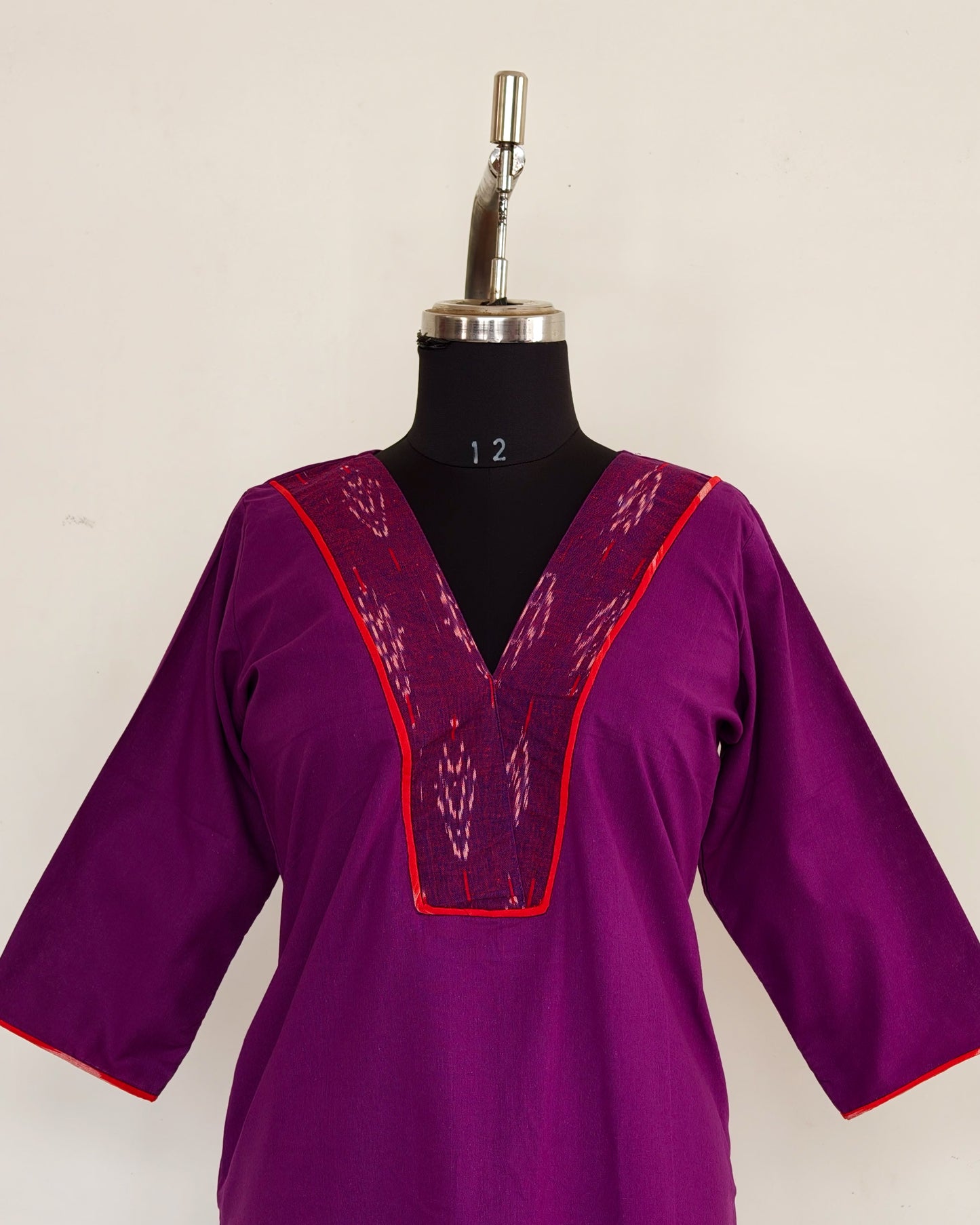 291 Purple with ikkat patch and red piping