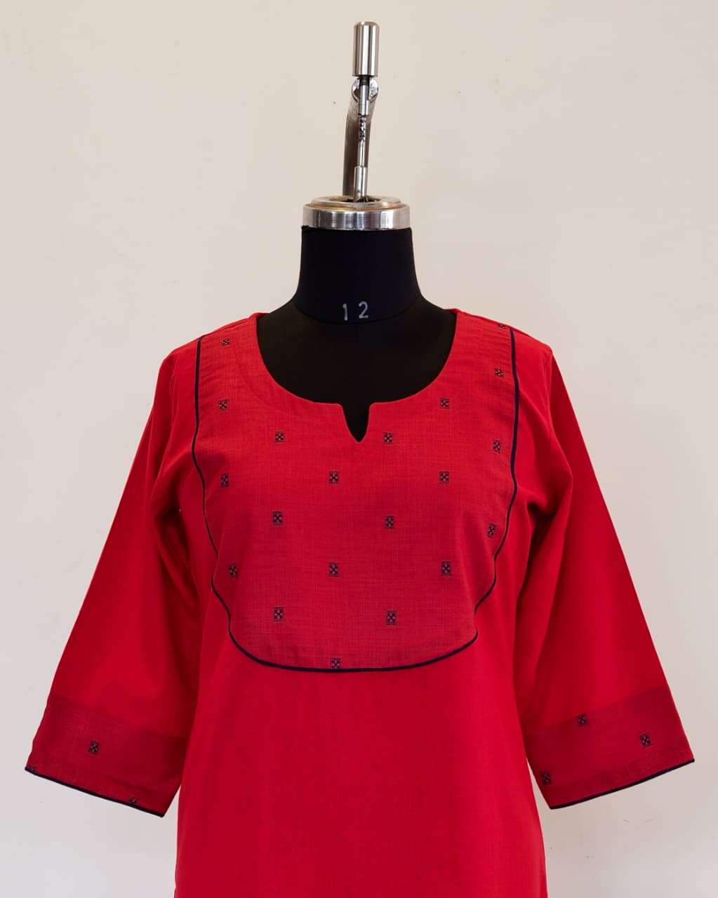 302 Red A-line kurta with navy blue butta yoke patch