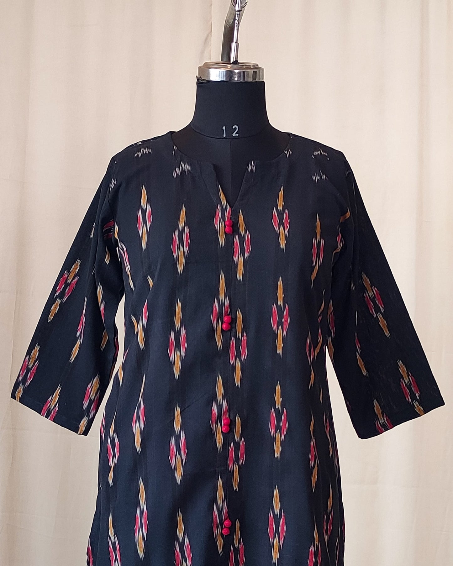 210	Black ikkat A line kurta with red potlis