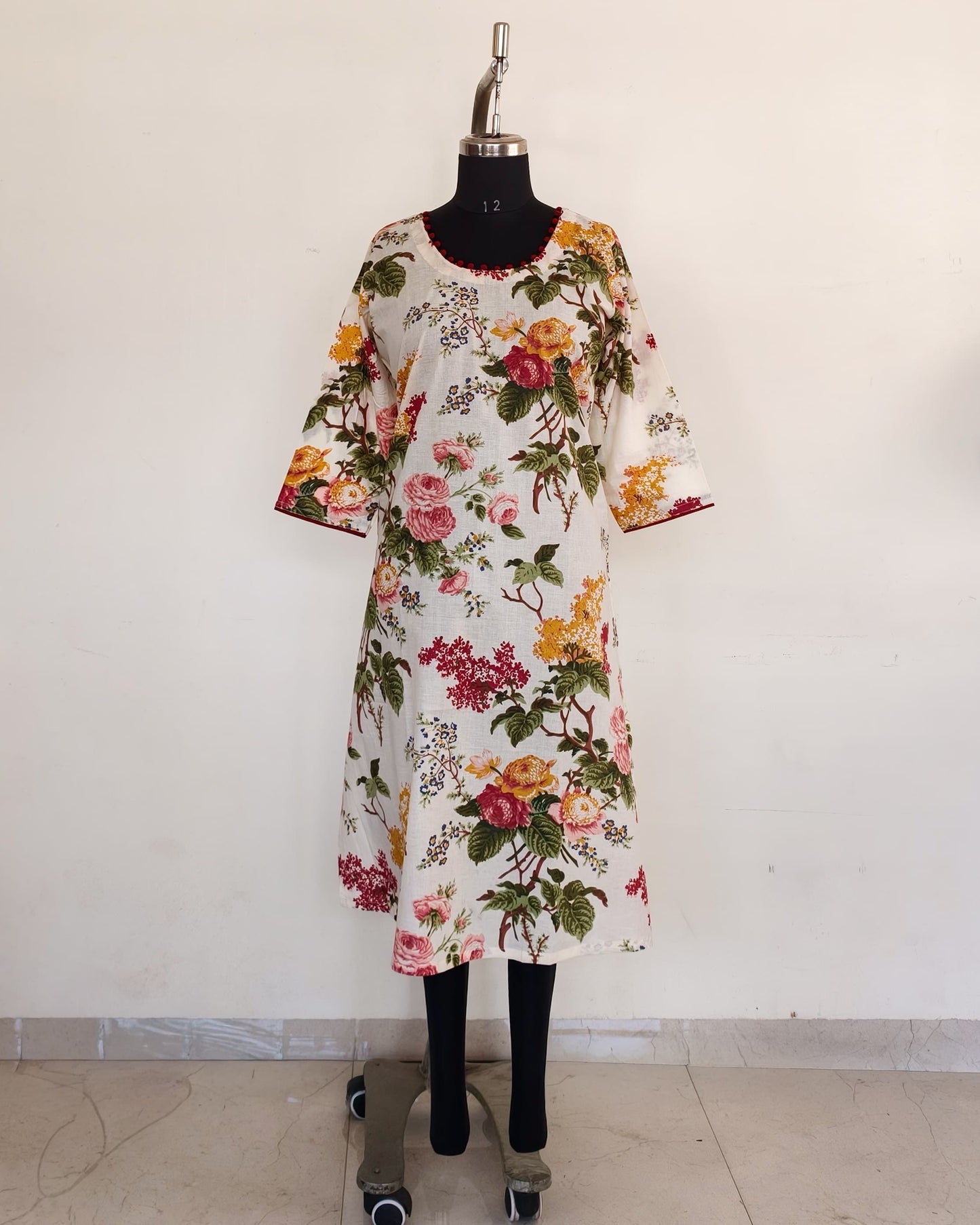 268 White floral kurta with potlis