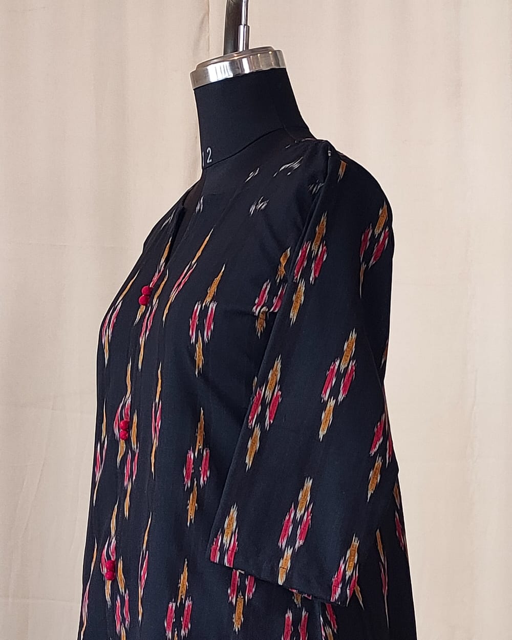 210	Black ikkat A line kurta with red potlis