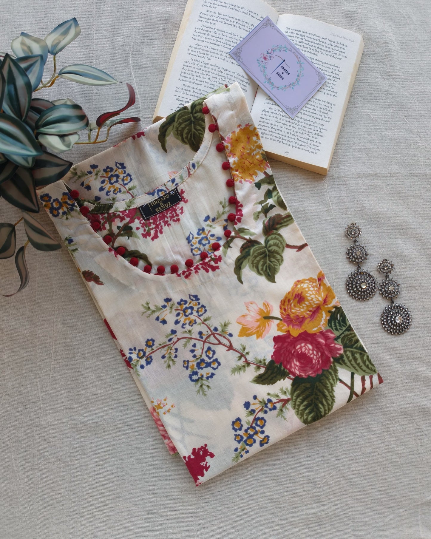 268 White floral kurta with potlis