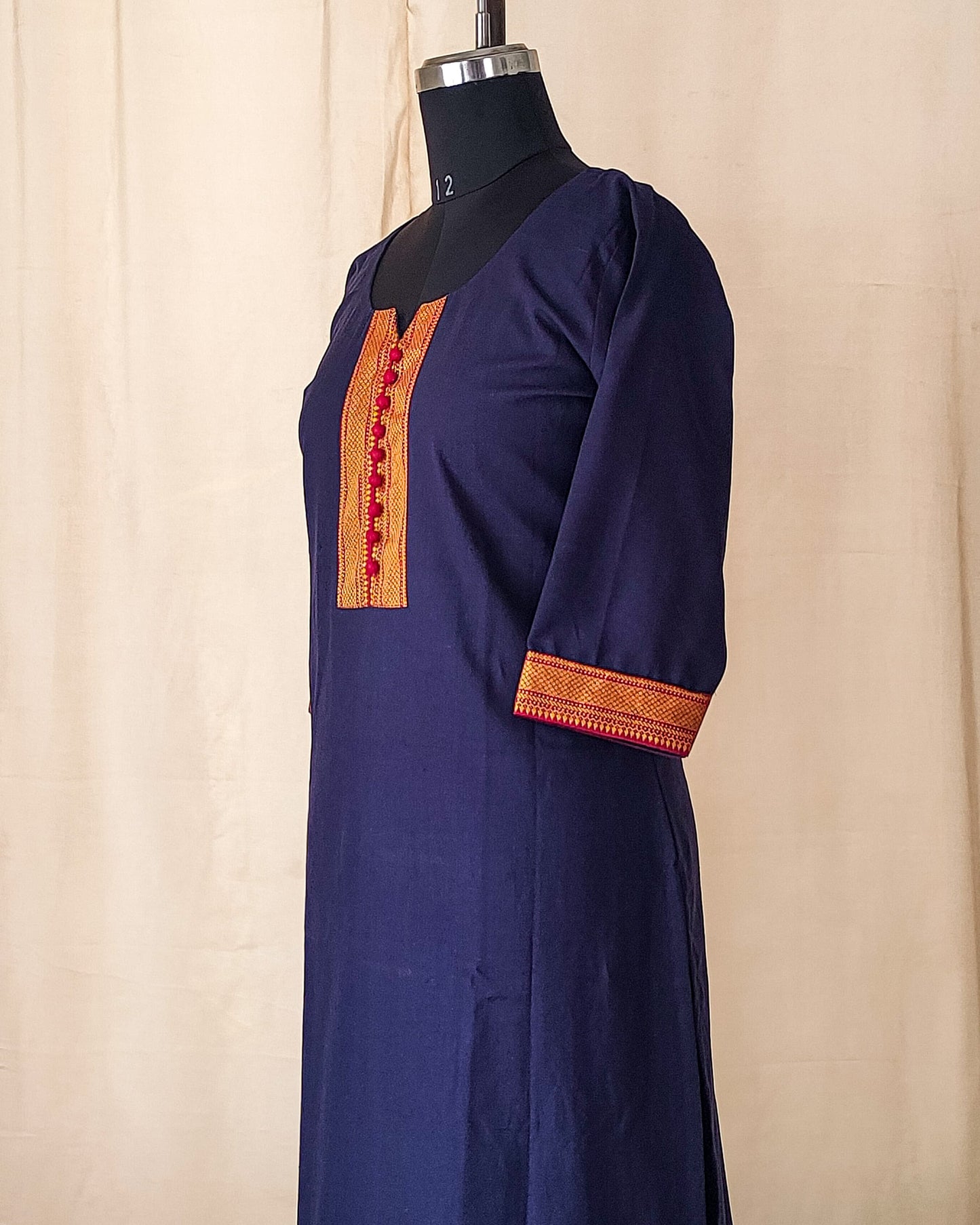 114 Navy Blue Kurta with Border and Red Potlis