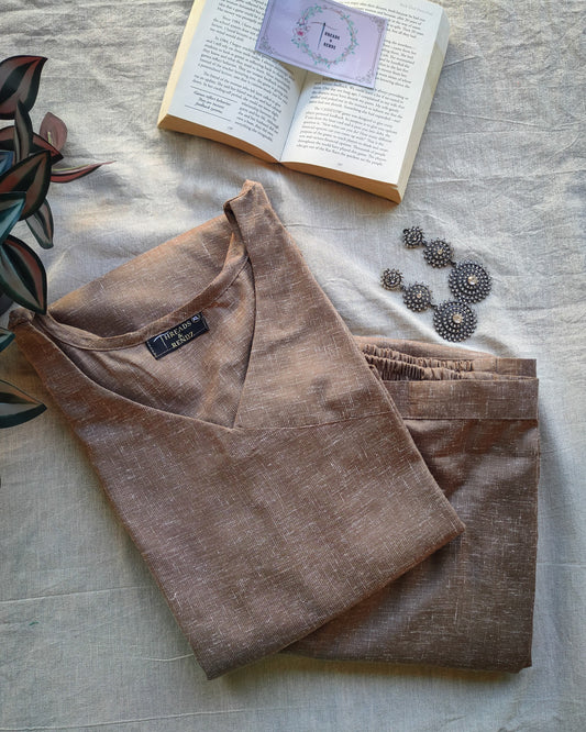 202	Beige co-ord set with overlap pattern and buttons