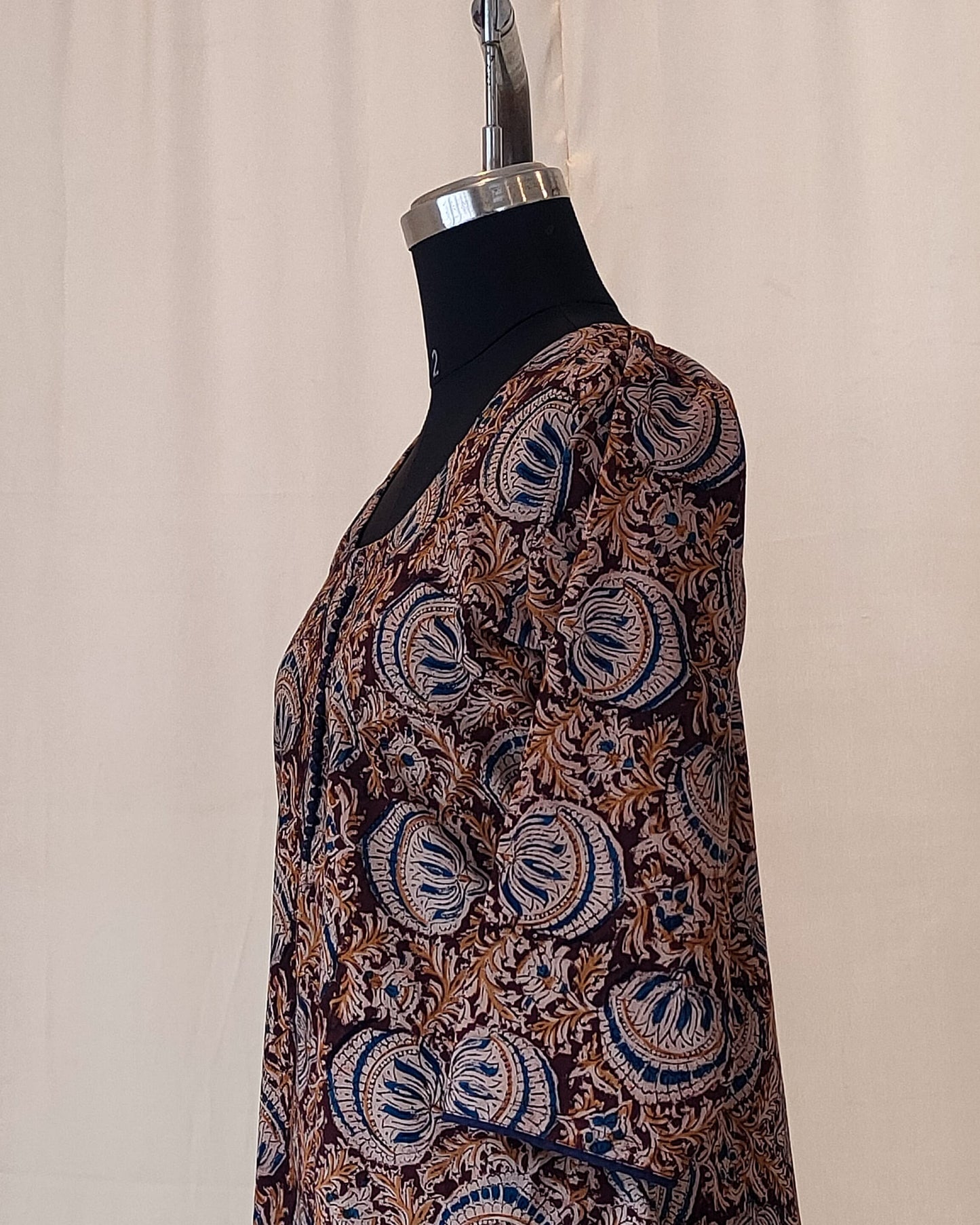 196	Maroon kalamkari A-line kurta with blue potlis