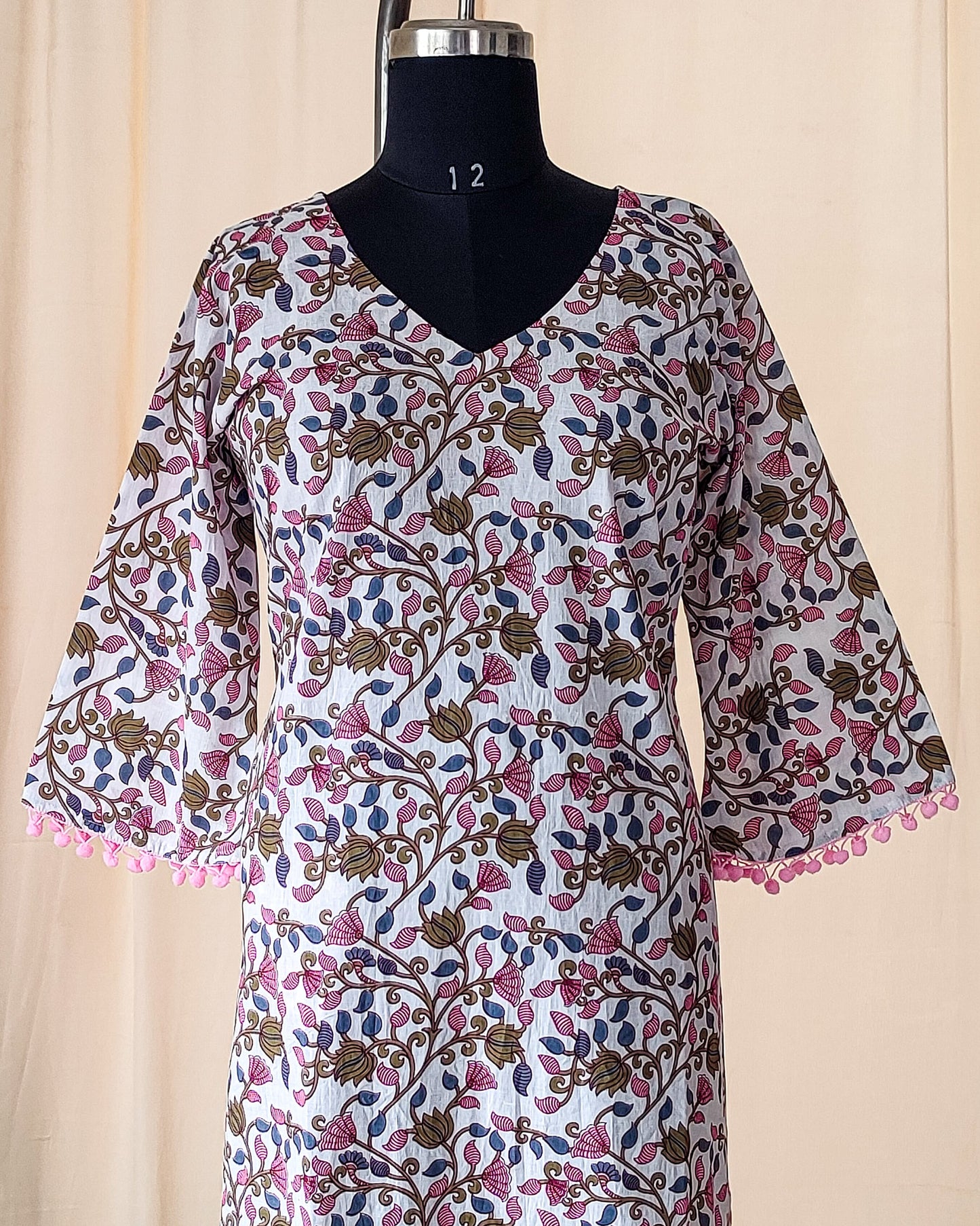 135 White Printed kurta with Pom-pom lace and bell sleeves