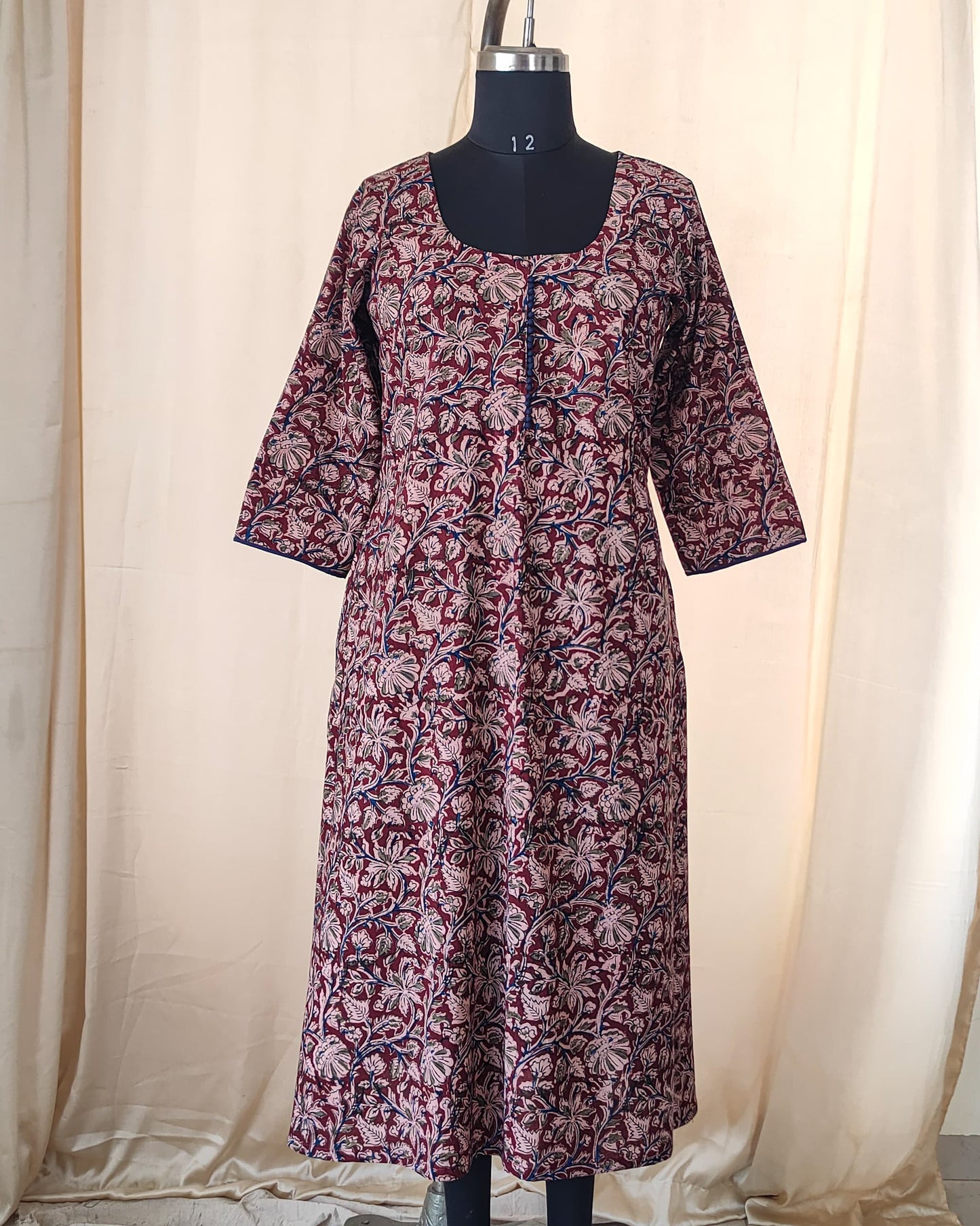 140 A Maroon kalamkari A-line Kurta with blue potlis