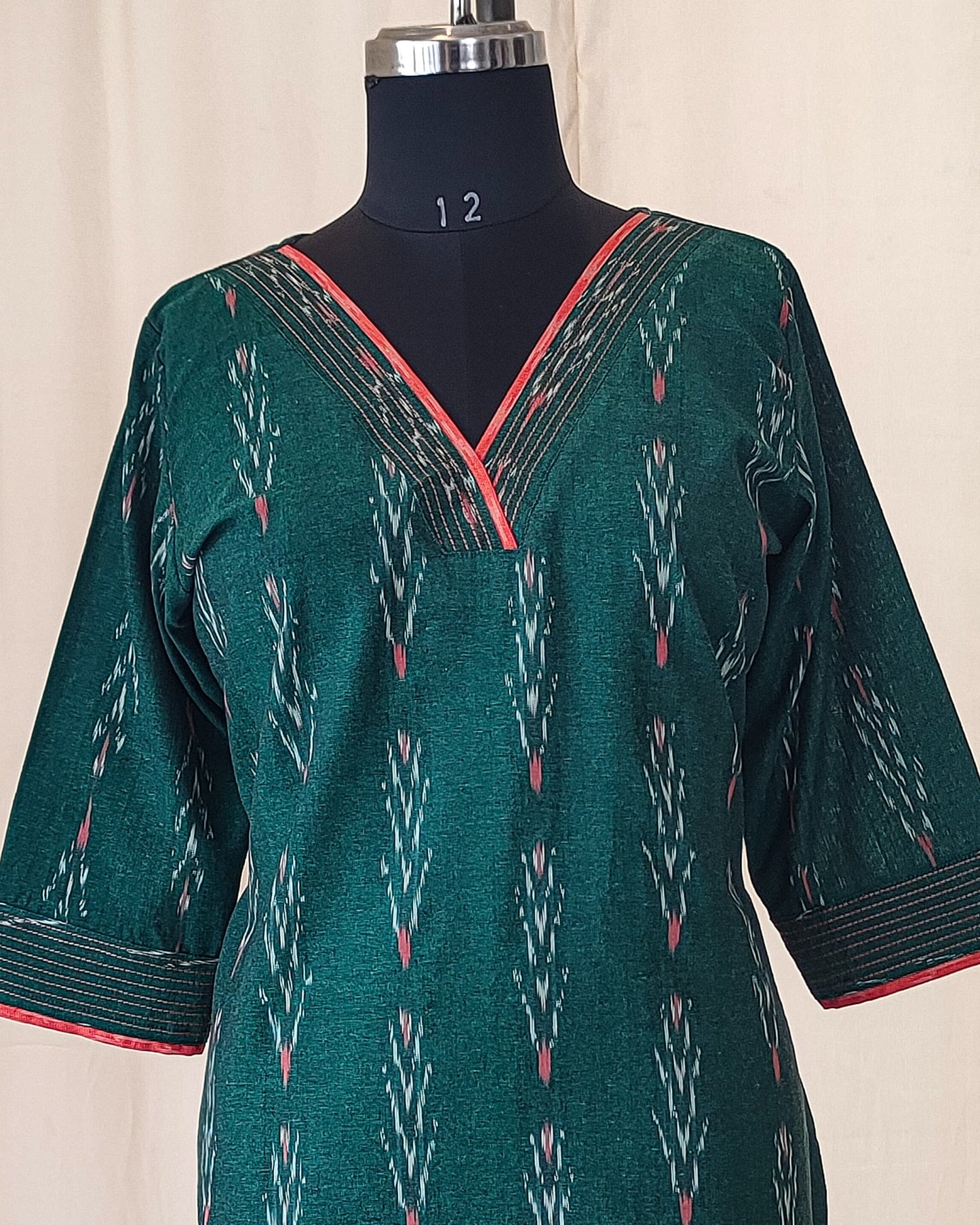 154 Bottle green ikkat kurta with orange detailing