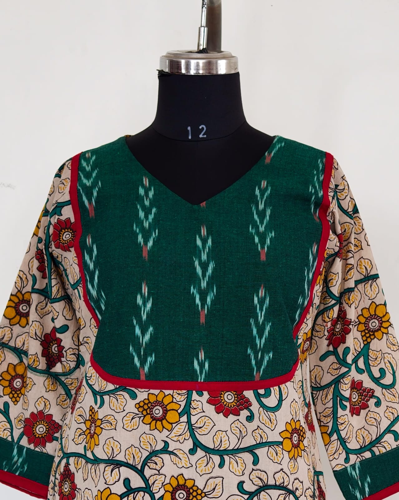 235 Cream floral kalamkari kurta with green ikkat yoke patch