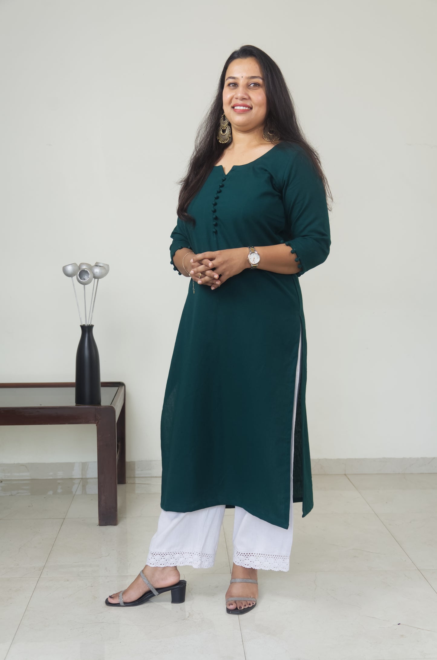 139 Plain Bottle green kurta with potlis