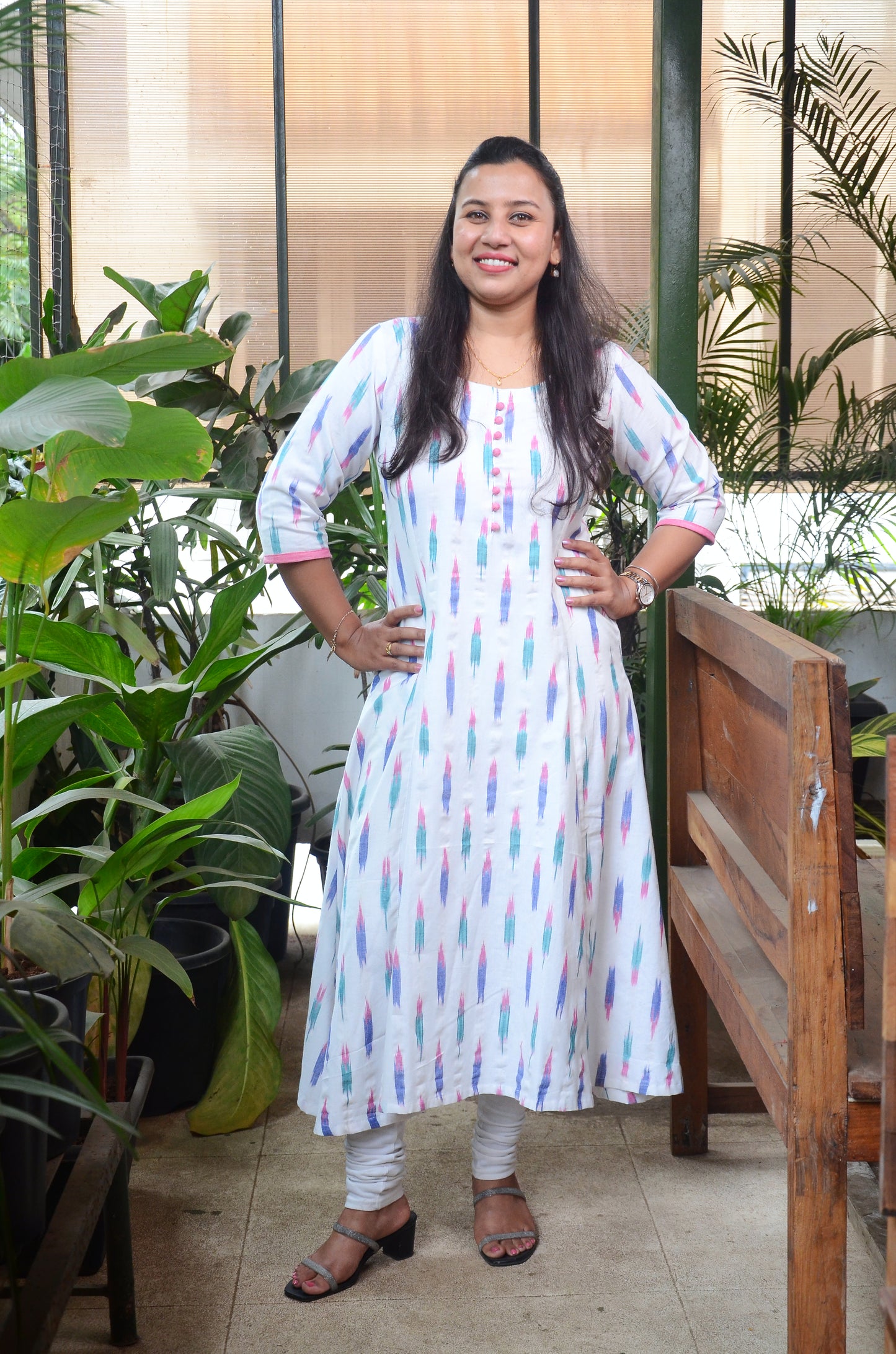 181 White ikkat fit n flare kurta with pink potlis