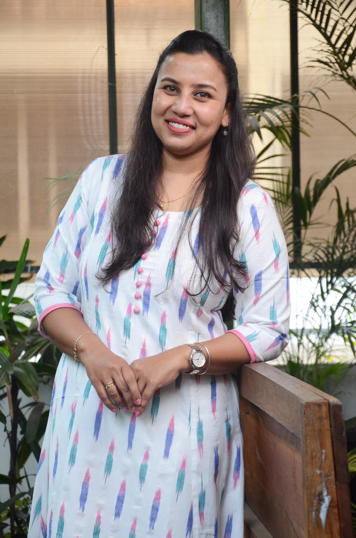 181 White ikkat fit n flare kurta with pink potlis