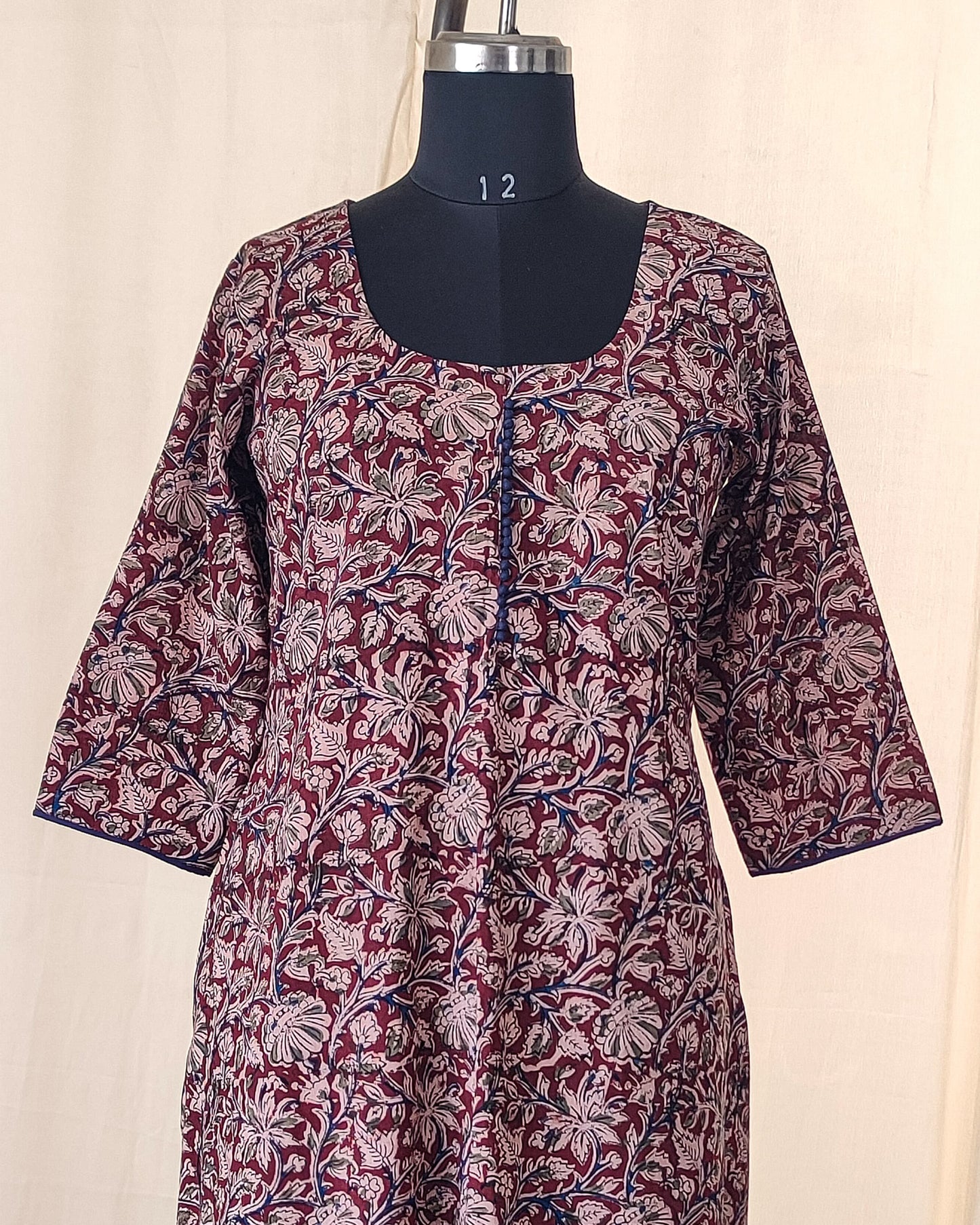 140 A Maroon kalamkari A-line Kurta with blue potlis