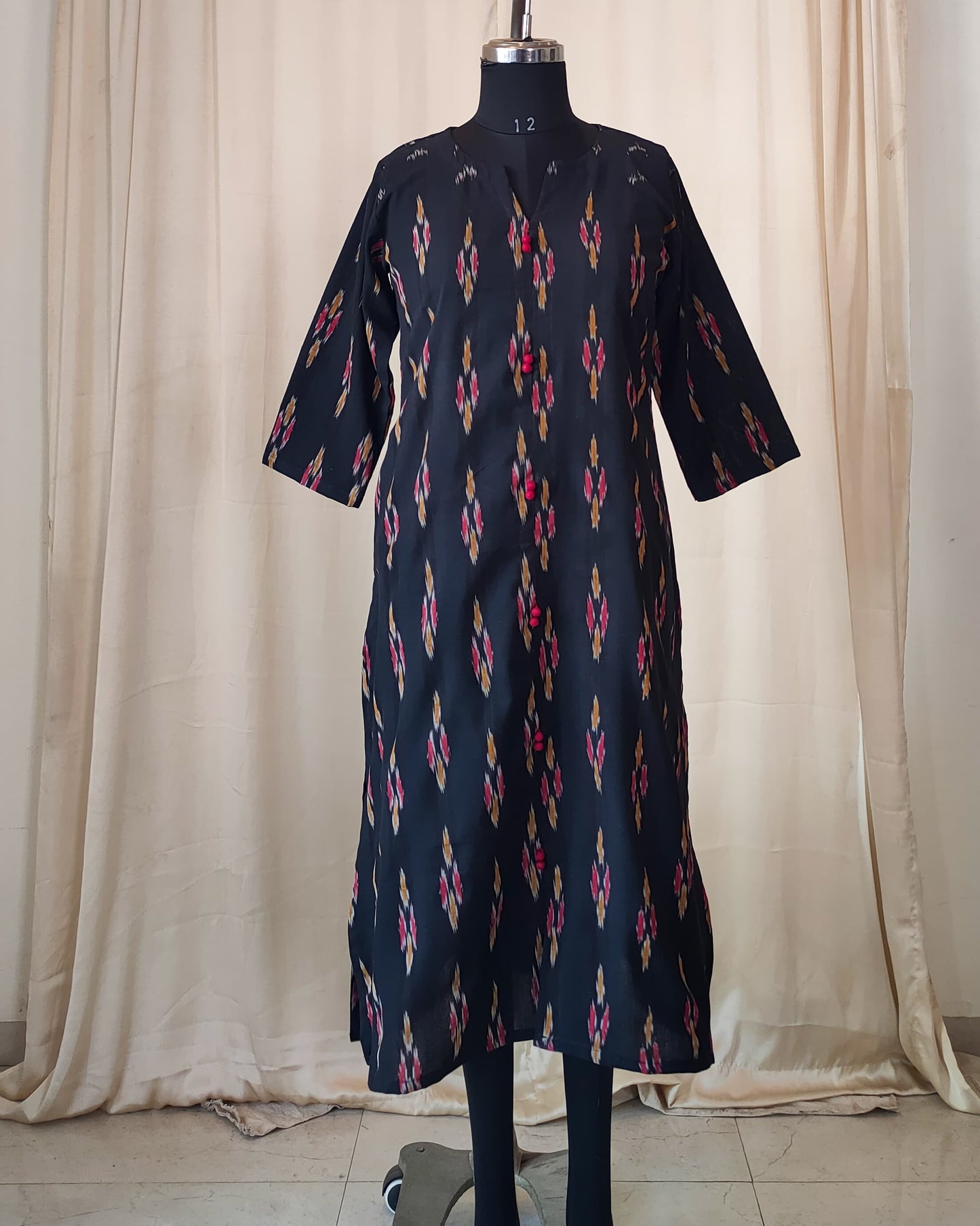 210	Black ikkat A line kurta with red potlis