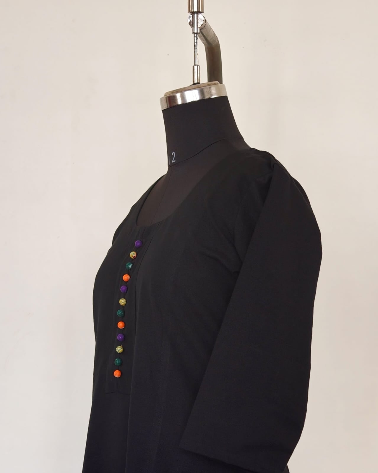 247 Black flare kurta with multicoloured Potlis