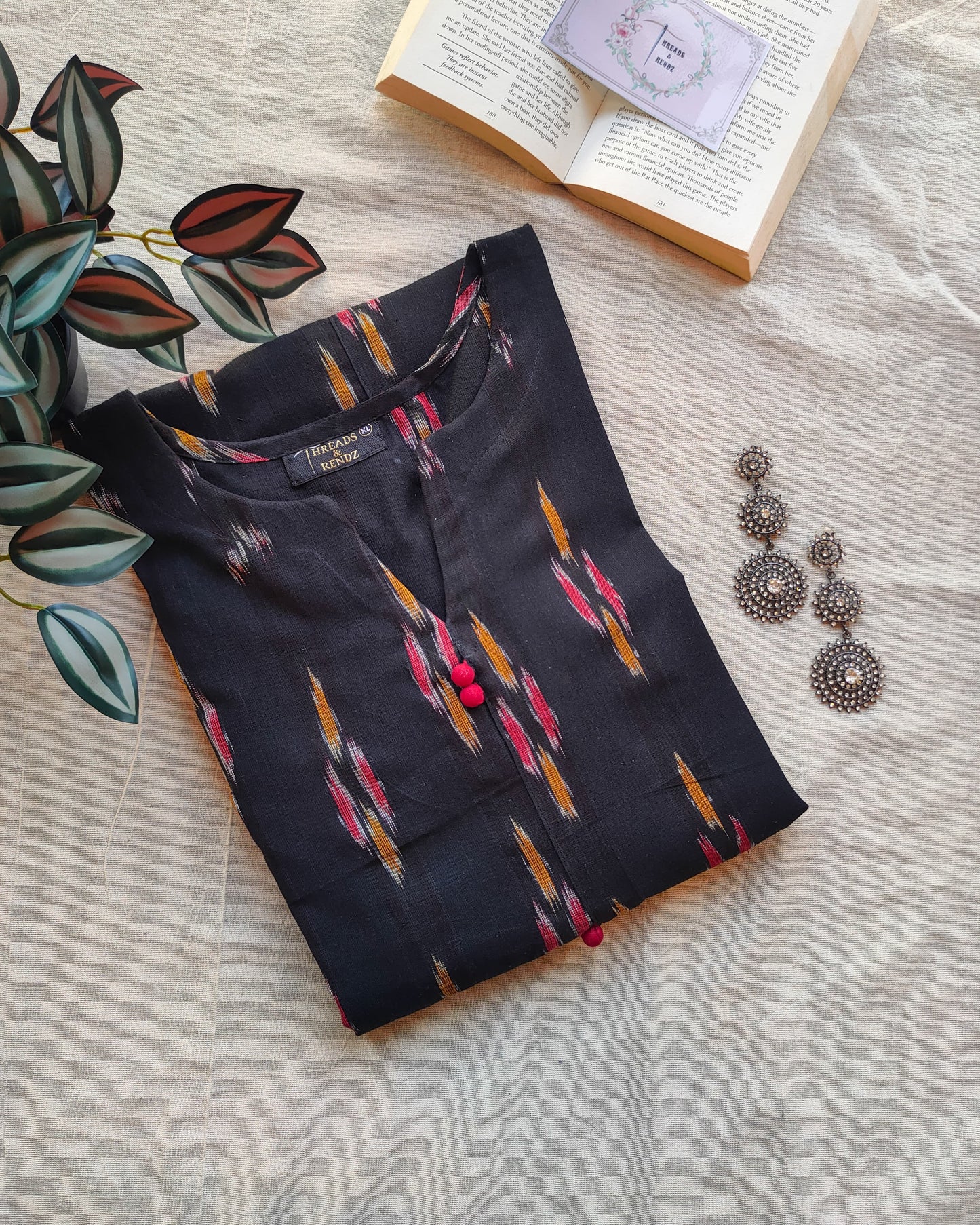 210	Black ikkat A line kurta with red potlis