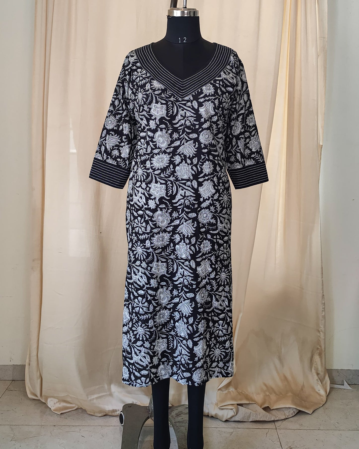 172 Black and white printed kurta with detailing on neck and sleeves