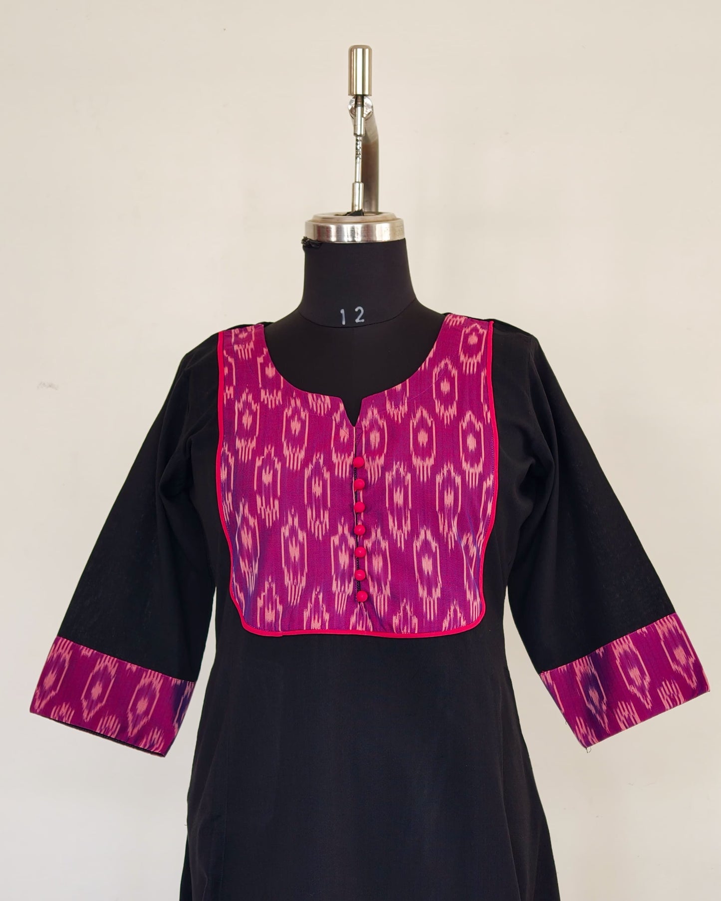 278 Black flare kurta with purple patch and pink potlis