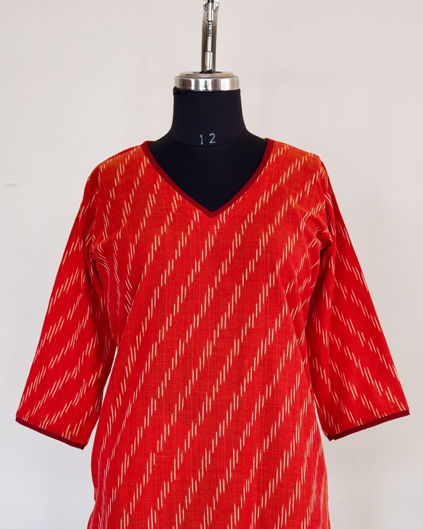 275 Orange ikkat with Maroon neck details