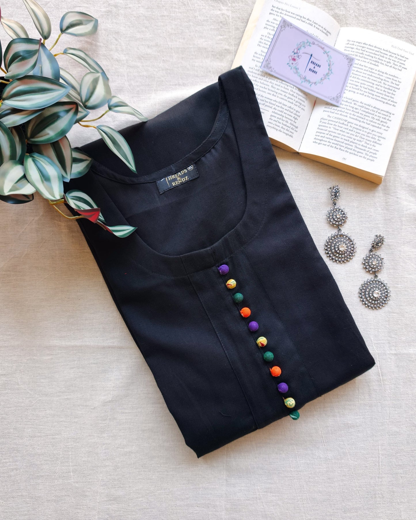 247 Black flare kurta with multicoloured Potlis