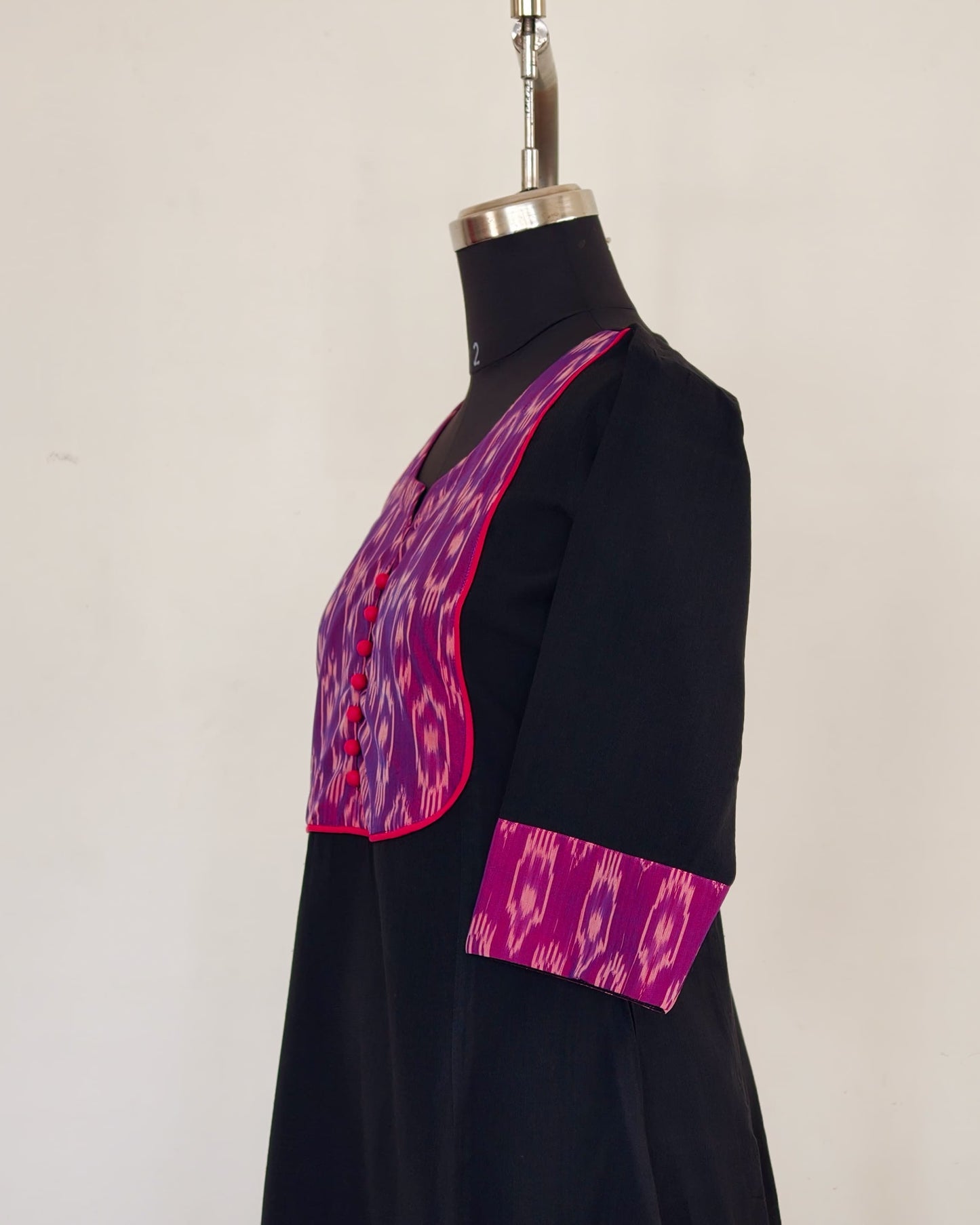 278 Black flare kurta with purple patch and pink potlis