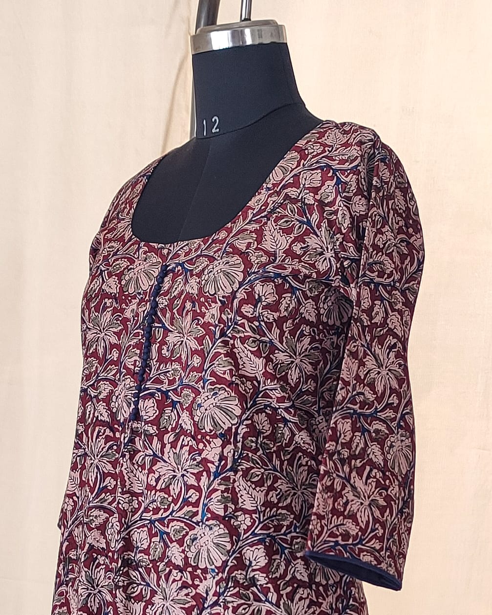 140 A Maroon kalamkari A-line Kurta with blue potlis