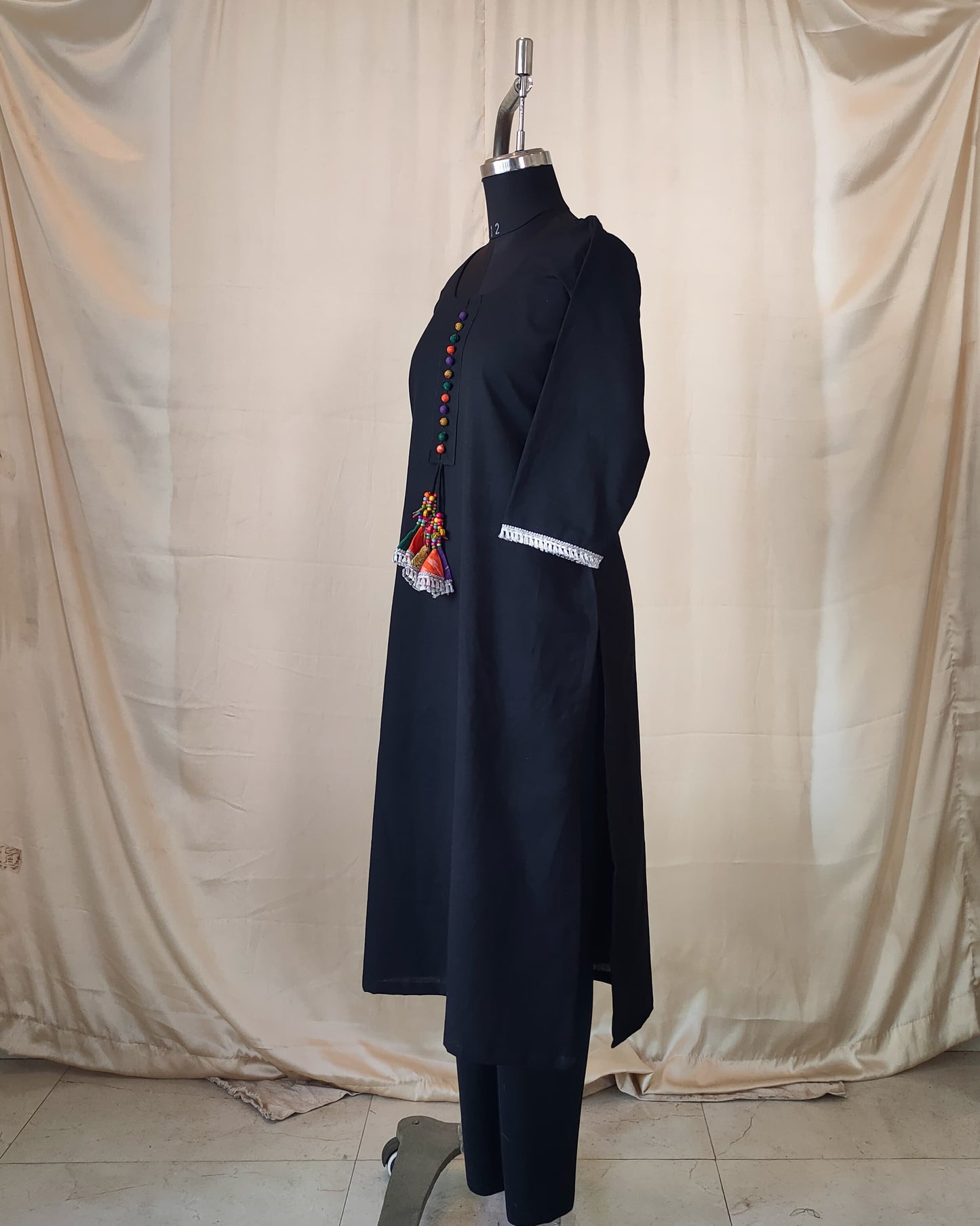 211	Black kurta with multicoloured potlis and tassels