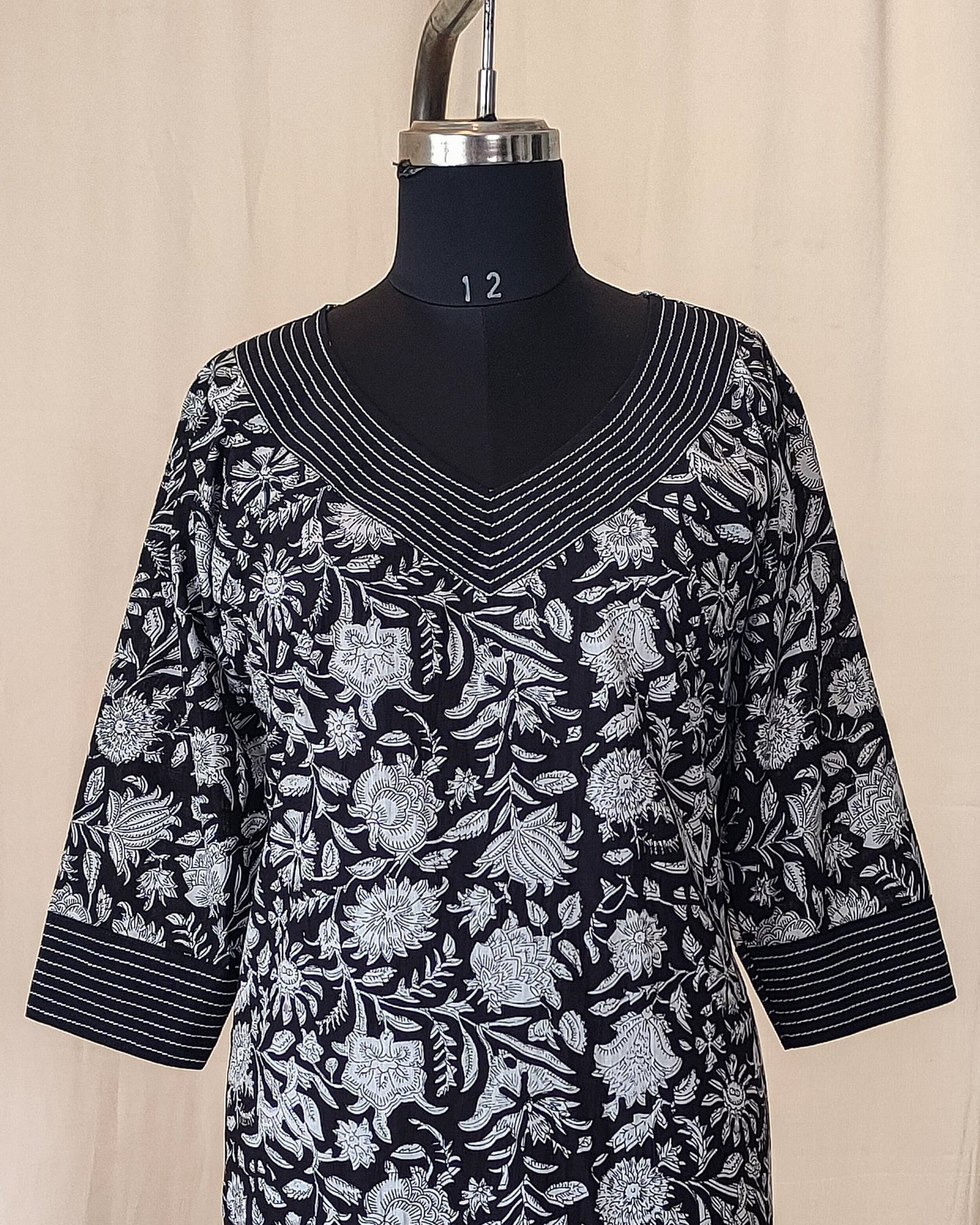 172 Black and white printed kurta with detailing on neck and sleeves