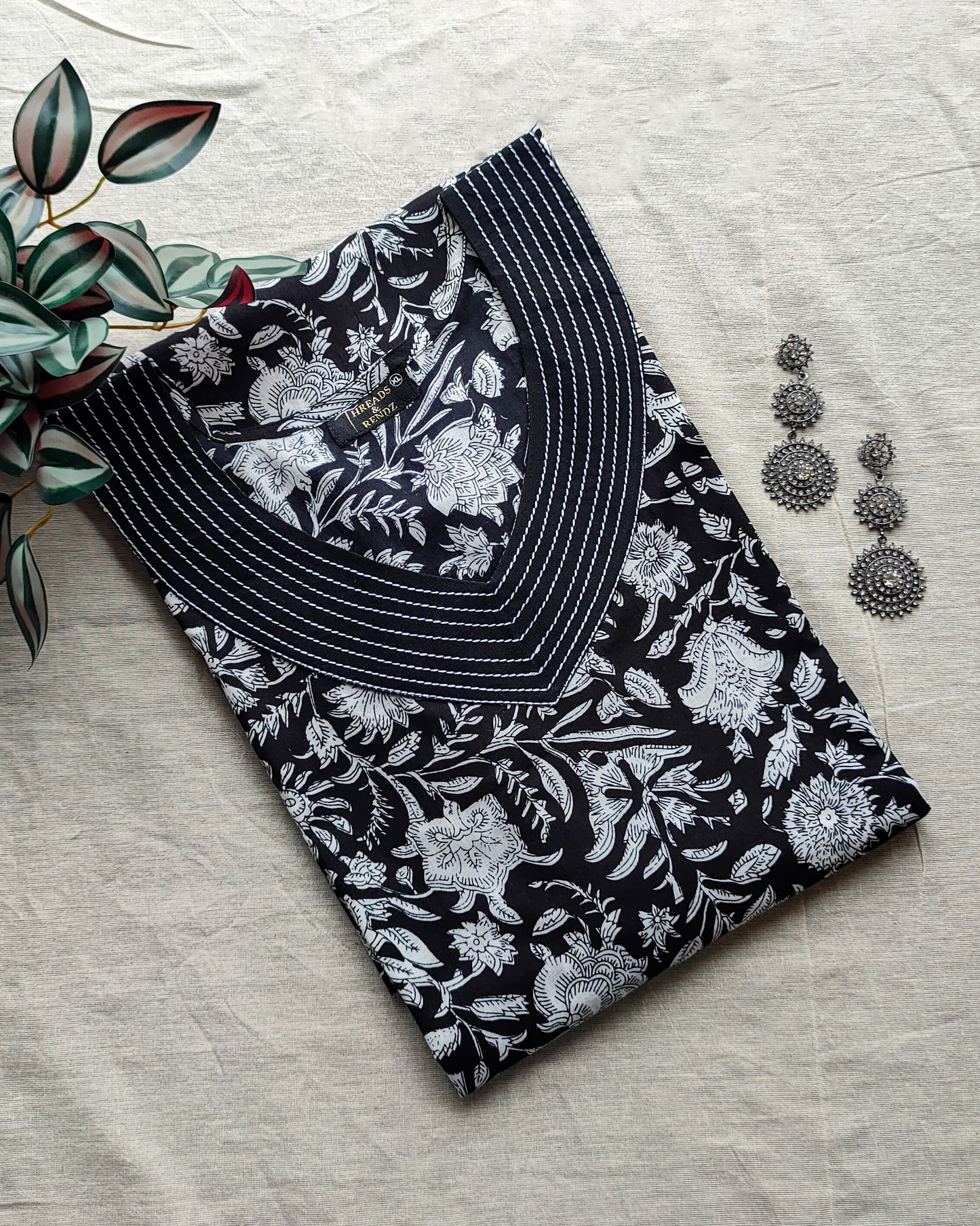 172 Black and white printed kurta with detailing on neck and sleeves