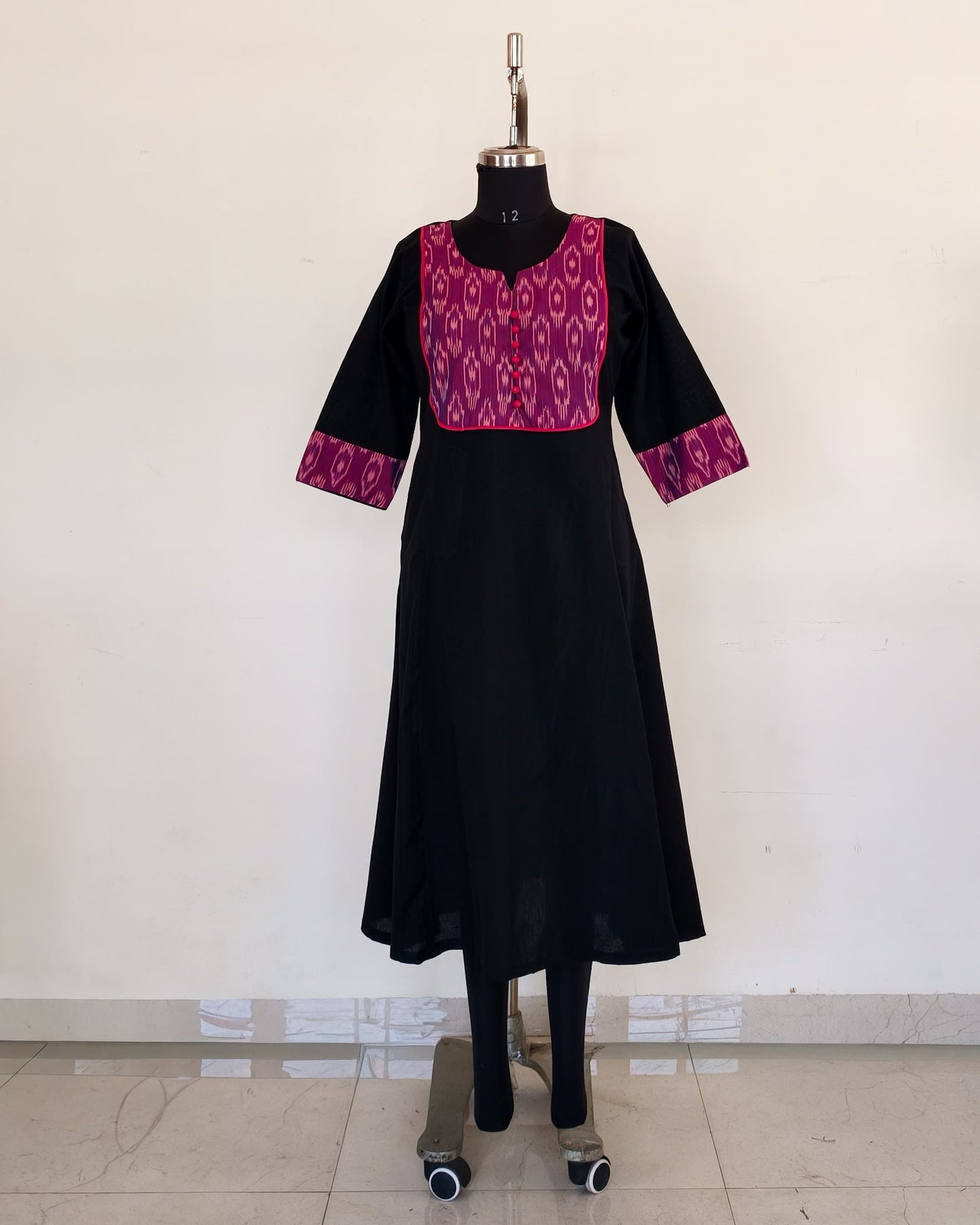 278 Black flare kurta with purple patch and pink potlis