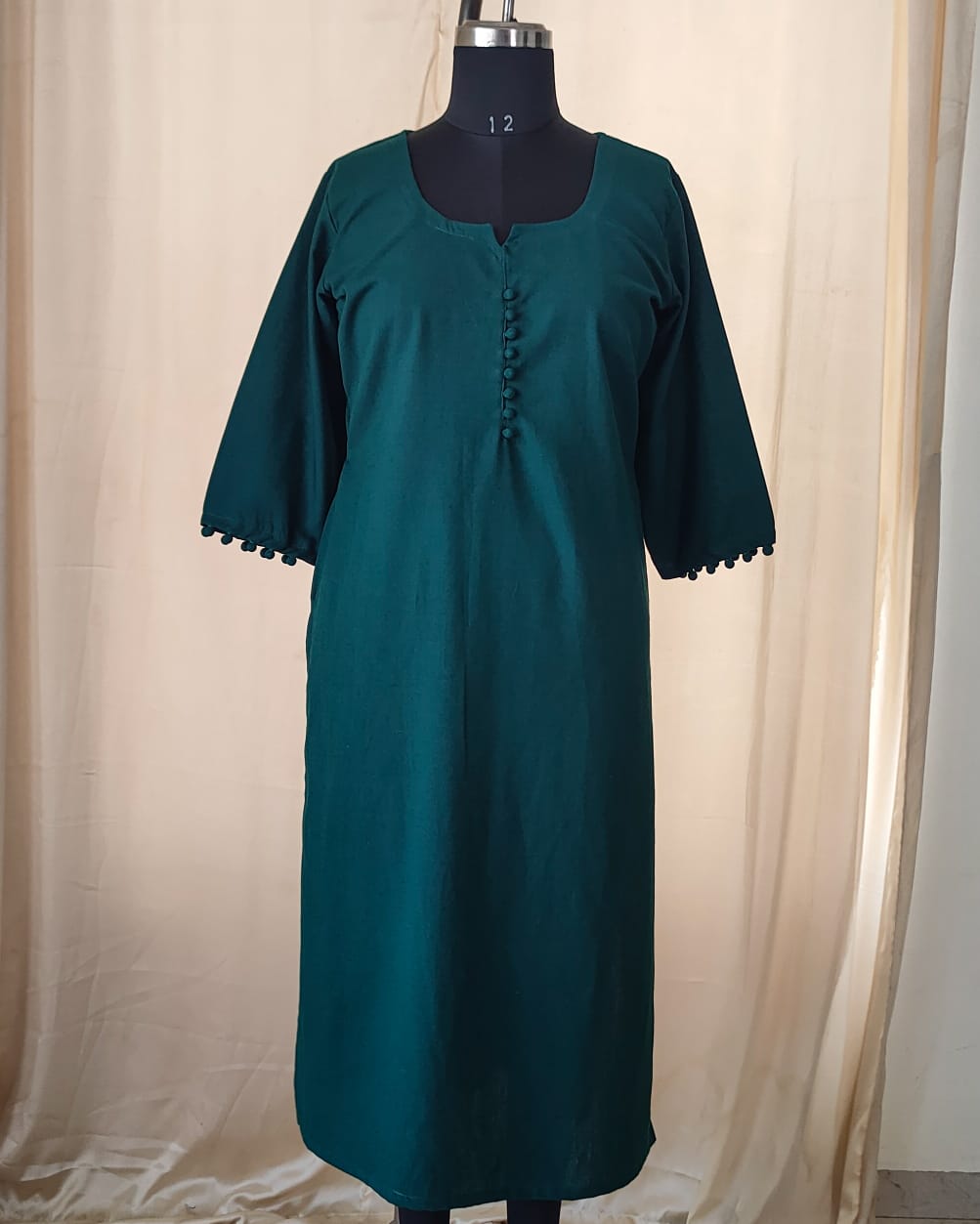 139 Plain Bottle green kurta with potlis