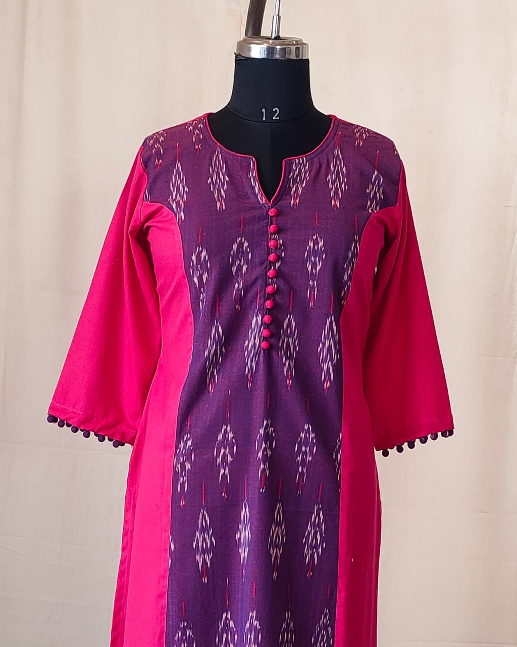 209	Pink n purple ikkat princess cut kurta with potlis