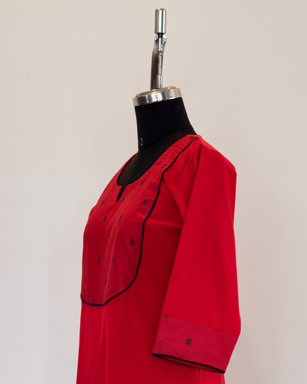 302 Red A-line kurta with navy blue butta yoke patch