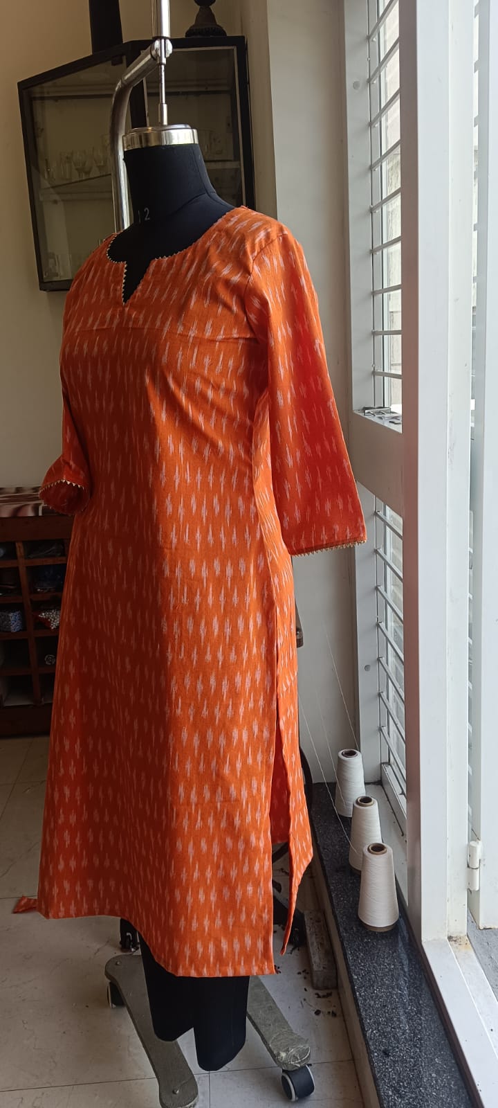168 Orange Ikkat Cotton Kurta With Golden Lace Detailing