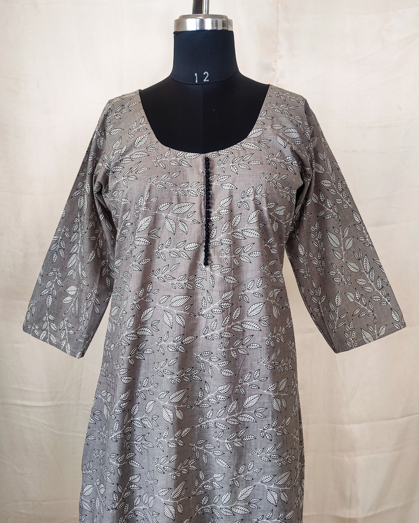 18 A Grey Leaf Print A-Line Kurta With Potlis